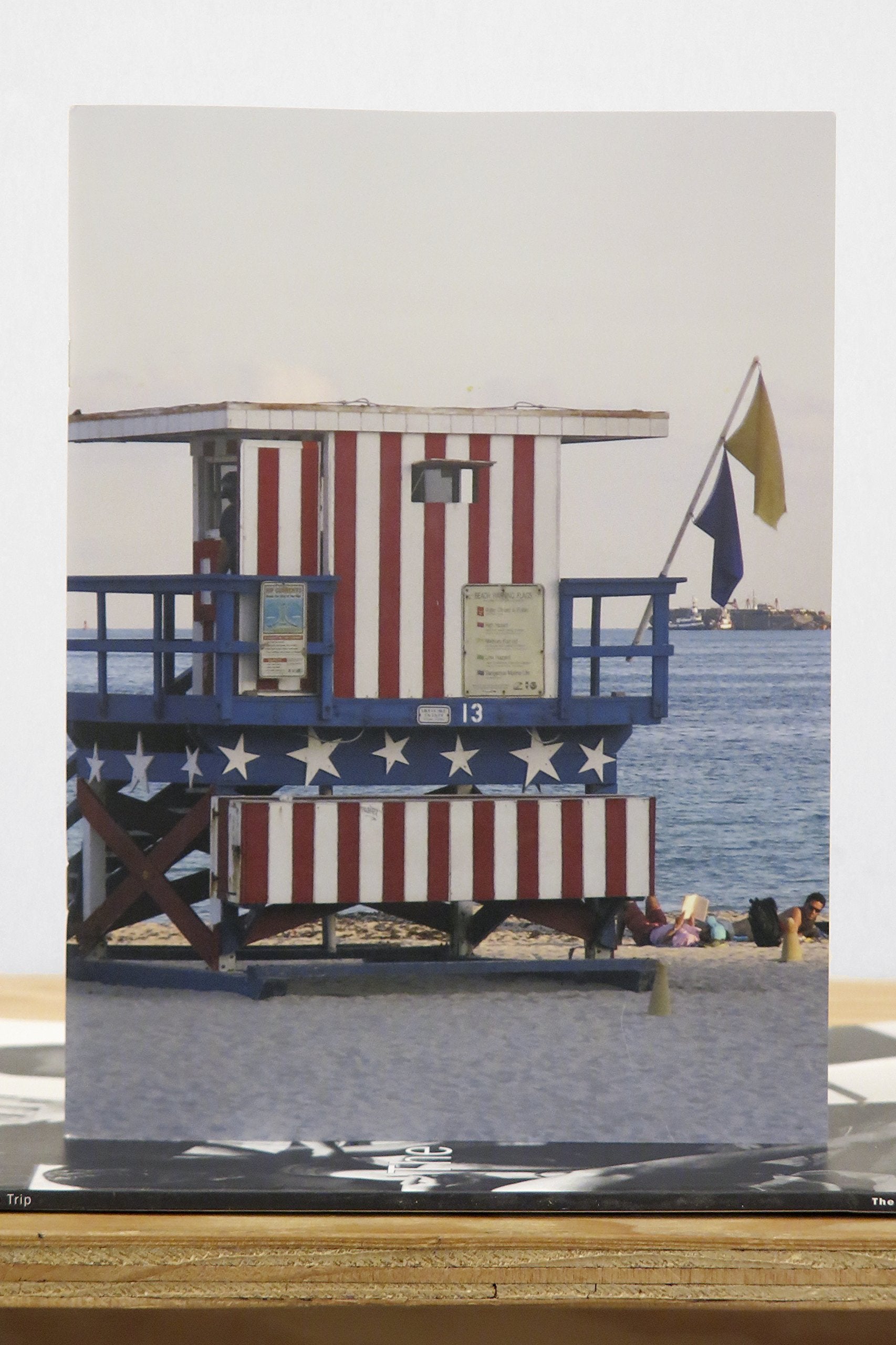 Paradise: `American Flag` seaside hut on cover
