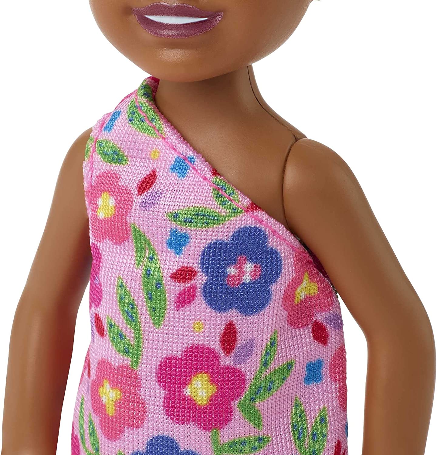 Barbie Chelsea Doll (Brunette Curly Hair) Wearing One-Shoulder Flower-Print Dress and Pink Shoes, Toy for Kids Ages 3 Years Old & Up