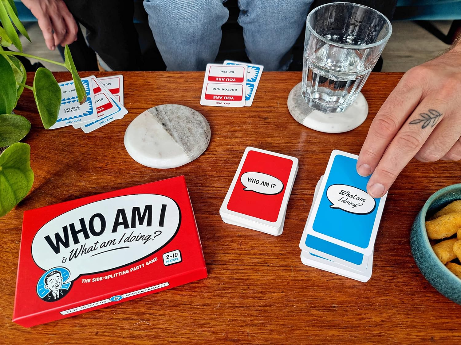 Who Am I & What Am I Doing? – Funny 2–10 Player Party Game – Charades & Impressions Card Game for Adults, Couples & Family - for Travel, Board Game Night or Dinner Party (14+