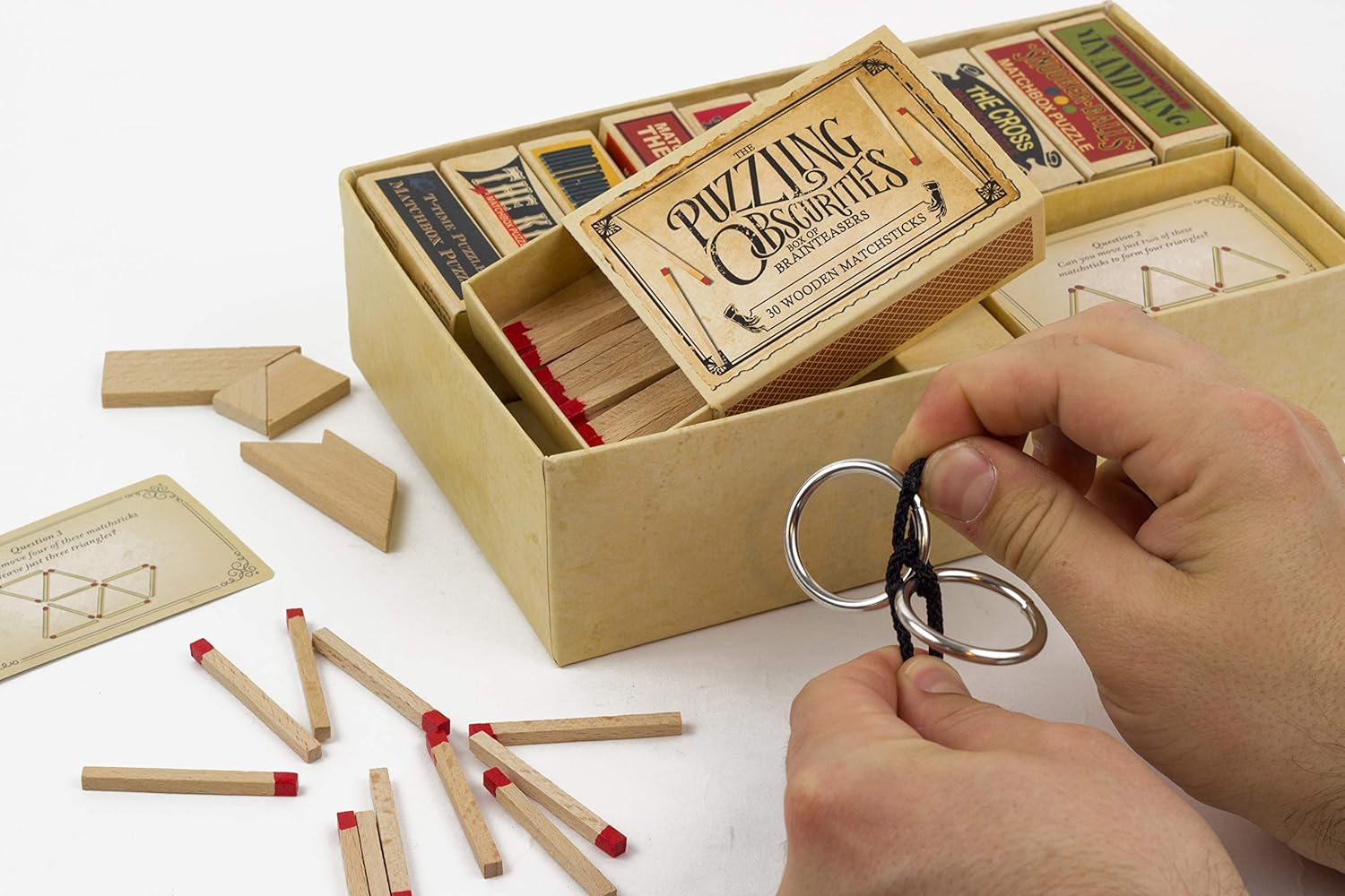 Professor Puzzle, Puzzling Obscurities Box of Brainteasers - 10 Unique Matchbox Puzzles & 50 Unique Brain Teasing Challenges