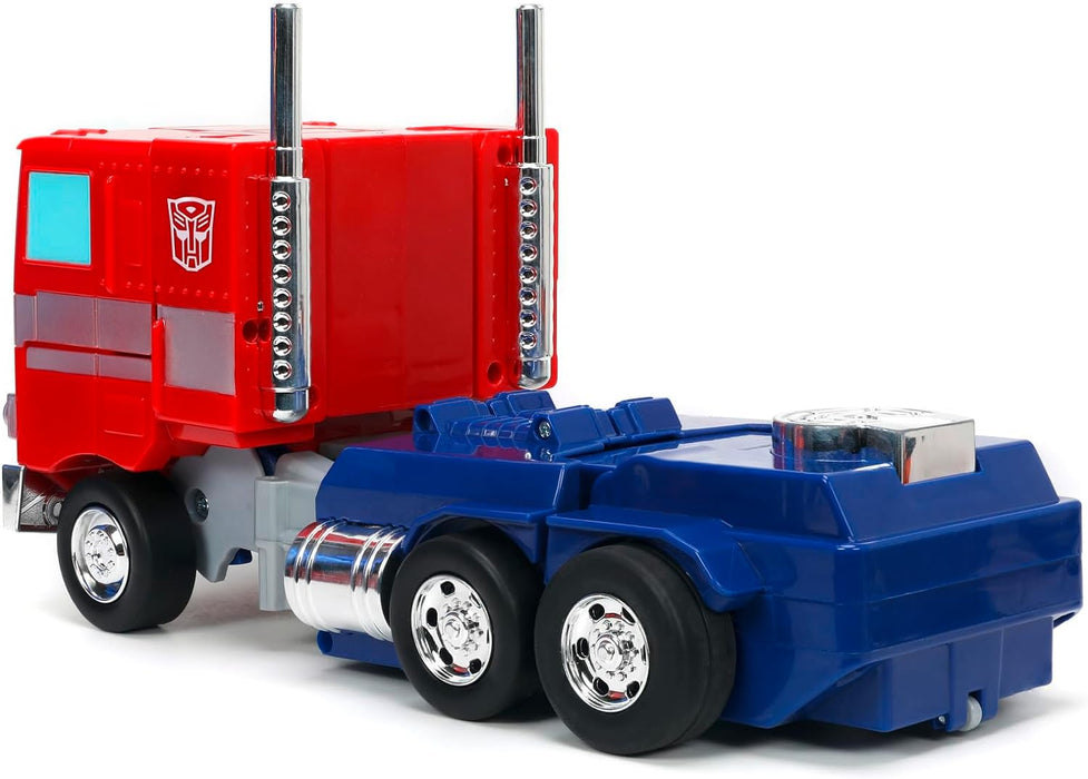 TRANSFORMERS Converting RC Optimus Prime – Original G1 model Remote Control Car - 30 cm long in Truck mode, standing 35 cm Tall converted to autobot mode with lights sounds and voice
