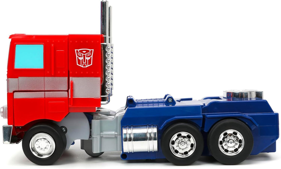 TRANSFORMERS Converting RC Optimus Prime – Original G1 model Remote Control Car - 30 cm long in Truck mode, standing 35 cm Tall converted to autobot mode with lights sounds and voice