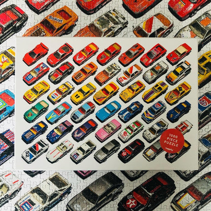Well Played / 1,000 Piece Jigsaw Puzzle for Adults from Happily | featuting diecast toy cars from the 80s & 90s | Retro Adult Jigsaw Puzzle