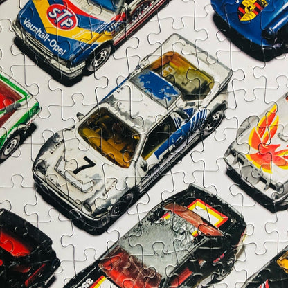 Well Played / 1,000 Piece Jigsaw Puzzle for Adults from Happily | featuting diecast toy cars from the 80s & 90s | Retro Adult Jigsaw Puzzle