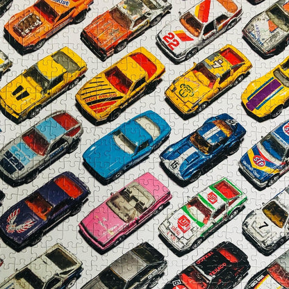 Well Played / 1,000 Piece Jigsaw Puzzle for Adults from Happily | featuting diecast toy cars from the 80s & 90s | Retro Adult Jigsaw Puzzle