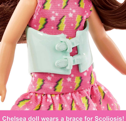 Barbie Toys, Chelsea Doll, 6-Inch Small Doll with Brace for Scoliosis Spine Curvature, Brunette Wearing Pink Lightning Bolt Dress