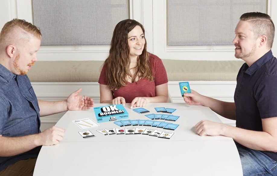 GOLIATH, OK Boomer! The iconic generational duel. Card game. Board games. Family games. Quizzes. Old School vs. New School. 14 years old, 2 to 8 players