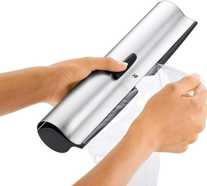 WMF Gourmet Folienschneider mit gezahntem Metaldeckel 32 cm, Cromargan Edelstahl, geeignet für Frischhalte-, Alufolie oder Back- Butterbrotpapier ab Single