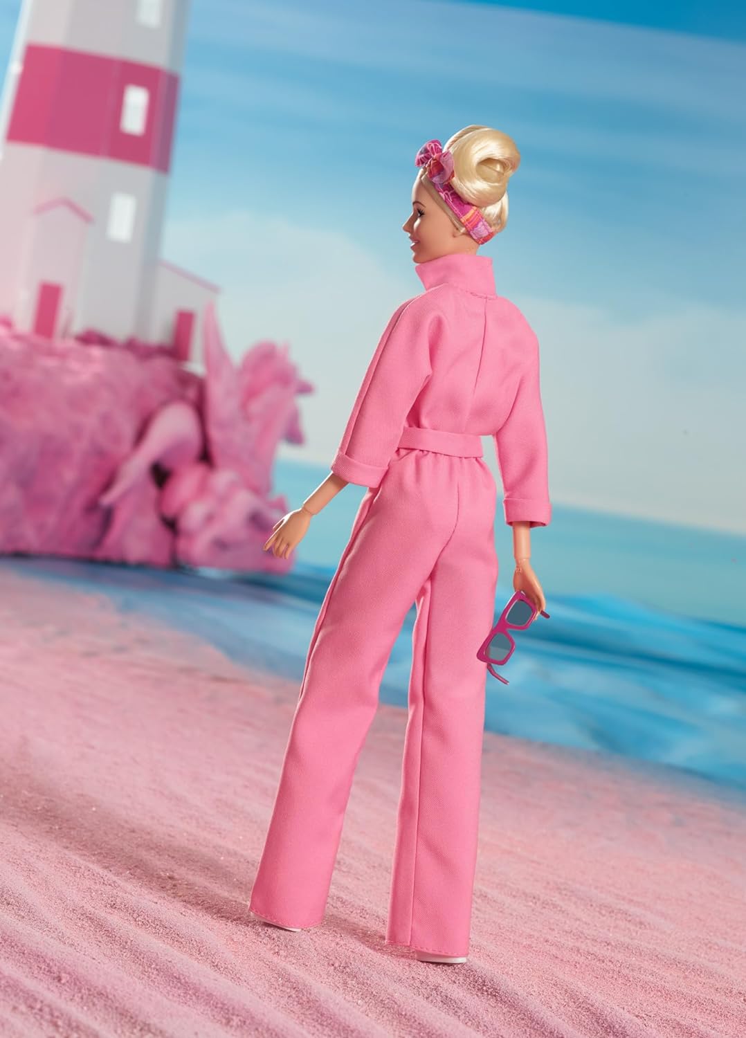 Barbie THE MOVIE, Margot Robbie as Barbie Doll from the movie, wearing pink jumpsuit, sunglasses and hairscarf, HRF29