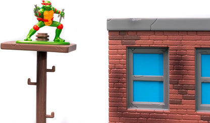 Jada Toys Ninja Turtles Nano Scene Turtle Lair (30 x 25 cm) - Telón de Fondo para coleccionar Figuras de Juguete (Incluye 4 Tortugas Ninja Mutantes Adolescentes de Metal y Accesorios de Juego, a