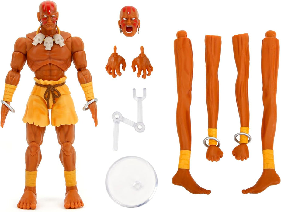 Jada - Street Fighter 2- Figura articulada de Dhalsim de 15 cm. con Manos y Cabeza Intercambiables, Accesorios y 20 Puntos articulados. A Partir de 13 años (253252031