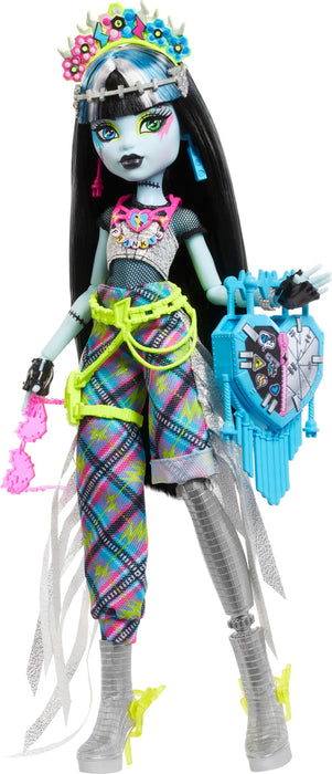 Monster High Monster Fest Frankie Stein, Muñeca con Top de Malla, Pantalones Plateados de Flecos asimétricos y Accesorios con temática de Festival, Juguete Regalo para niños y niñas +4 años, HXH79