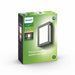 The Philips Karp LED outdoor wall light in anthracite grey suspends a large panel of diffuse warm white light in an elegant frame of