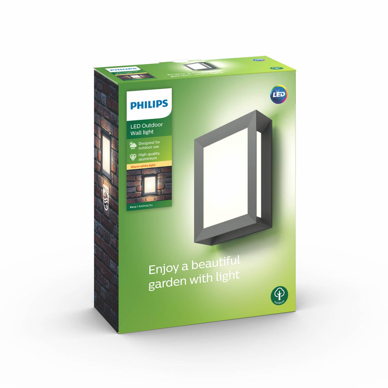 The Philips Karp LED outdoor wall light in anthracite grey suspends a large panel of diffuse warm white light in an elegant frame of