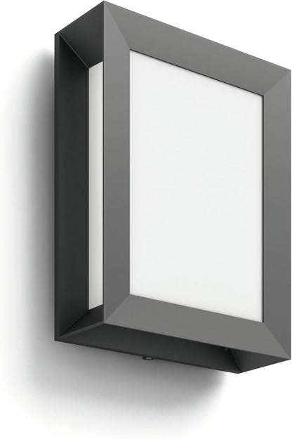 The Philips Karp LED outdoor wall light in anthracite grey suspends a large panel of diffuse warm white light in an elegant frame of