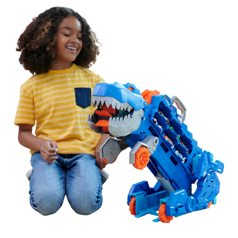Hot Wheels City “Let's Race - ¡a Correr!” Netflix - Camión T-Rex definitivo Dinosaurio Transporte y Pista para Coches de Juguete, Incluye 2 vehículos, +4 años (Mattel HNG50)