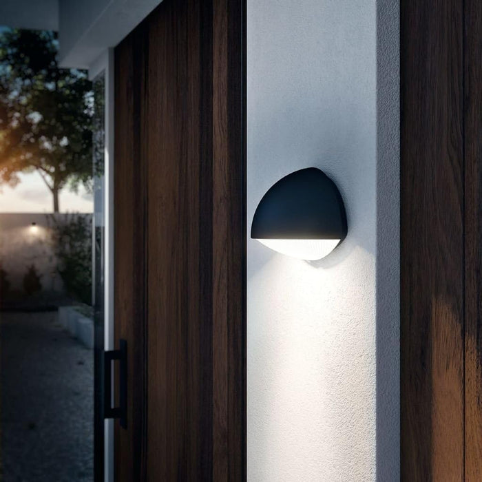 This half-moon Philips myGarden Dust LED wall light in aluminium finished in anthracite creates a subtle silhouette on your outdoor