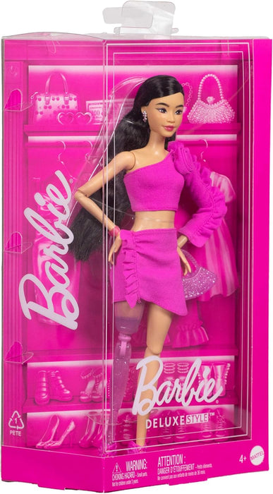 Barbie Deluxe Style Doll #2 in Barbiecore Outfit, Black Hair and Glittery Prosthetic Leg, Pink Top and Skirt Set with Rosette Detail and Accessories