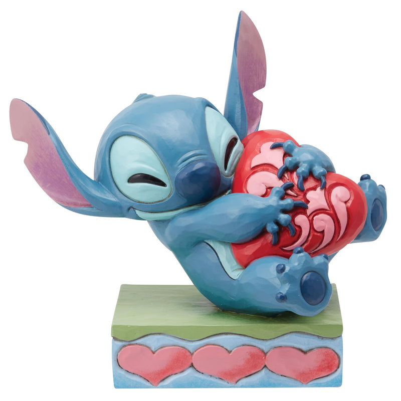 Enesco Jim Shore Stitch - Statuetta a forma di cuore che abbraccia