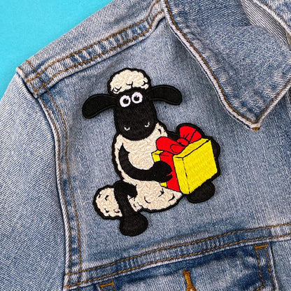 Pawprint Family | Shaun with Present Sew on Patch | Shaun The Sheep Official Merchandise