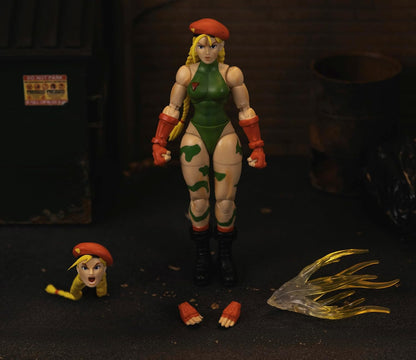 Jada - Figura articulada del Personaje de Street Fighter Cammy de 15 cm. con Manos y Cabeza Intercambiables, Accesorios y 20 Puntos articulados. Videojuegos Street Fighter. (253252033)