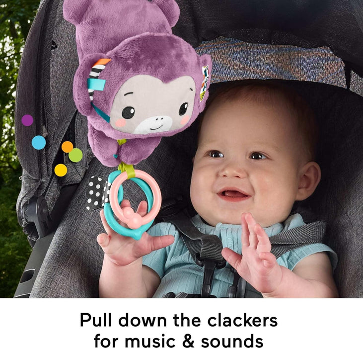 Fisher-Price Baby Stroller Toy Sing & Go Purple Monkey Musical Sensory Plush with Crinkle & Clackers for Newborns from Birth+, JBG94