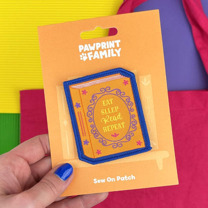 Pawprint Family | Eat, Sleep, Read, Repeat Sew on Patch | World Book Day Official Merchandise