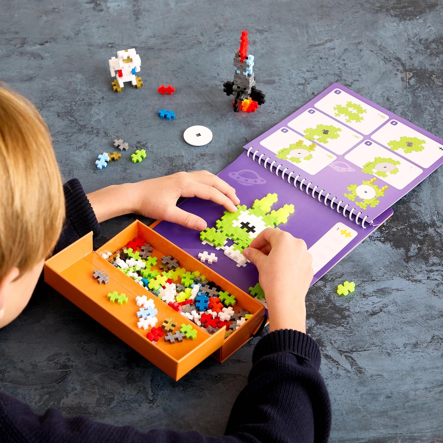 PLUS PLUS Travel Toys - Building Blocks Puzzle Play, Ideal Train, Car, or Plane Activities for Kids, 12 Pages with 125 Pieces in Attached Storage, Girls and Boys Toys Age 5 Plus