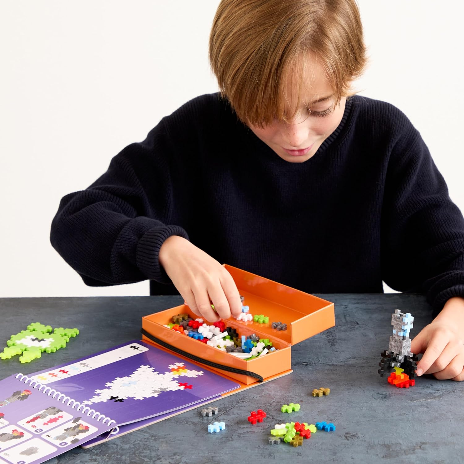PLUS PLUS Travel Toys - Building Blocks Puzzle Play, Ideal Train, Car, or Plane Activities for Kids, 12 Pages with 125 Pieces in Attached Storage, Girls and Boys Toys Age 5 Plus
