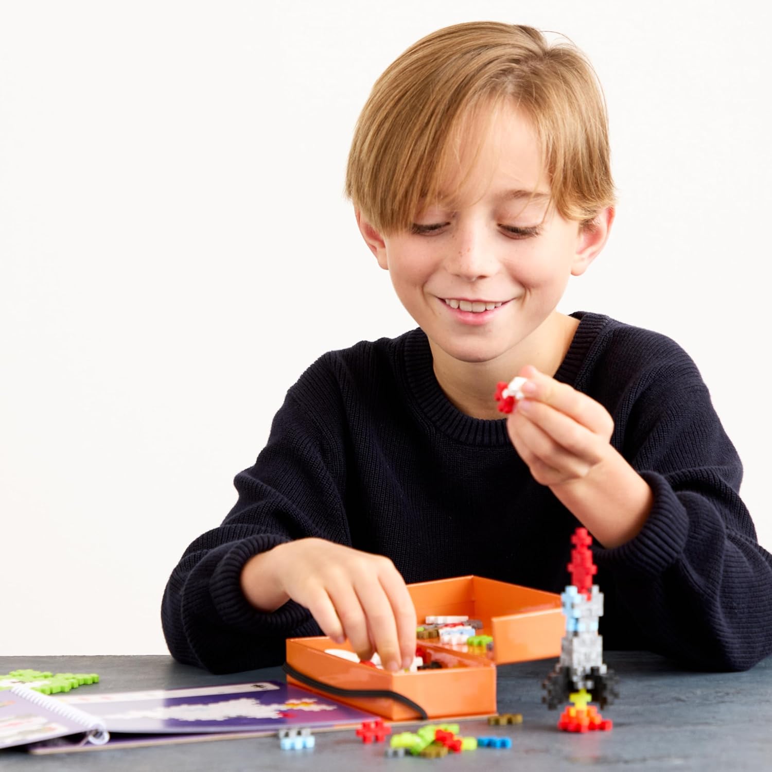 PLUS PLUS Travel Toys - Building Blocks Puzzle Play, Ideal Train, Car, or Plane Activities for Kids, 12 Pages with 125 Pieces in Attached Storage, Girls and Boys Toys Age 5 Plus