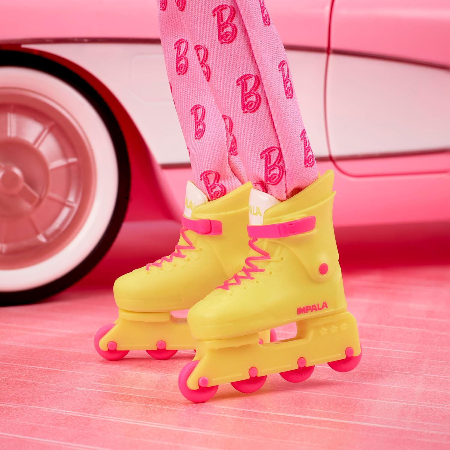 Barbie The Movie Ken Collectible Doll, Ryan Gosling as Ken Wearing Pink Jumpsuit with “B” Detail With White Sneakers and MultiColor Roller Skates, JCP80