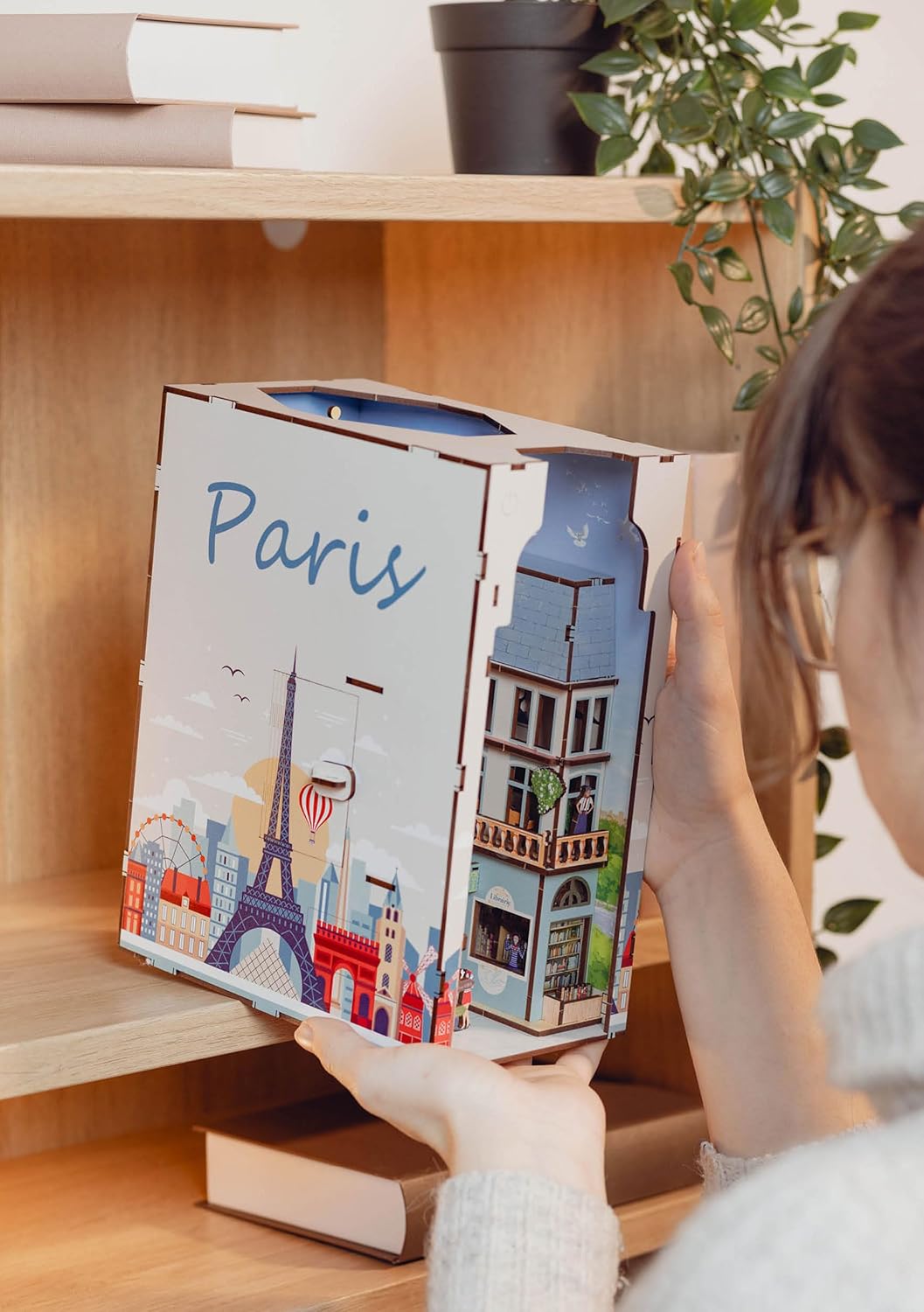 Revell Paris: Tiny Adventures Paris Book Nook - Magical Miniature World for Your Bookshelf, 168 Laser-Cut Wooden Parts with fine details Atmospheric LED Ambient Lighting