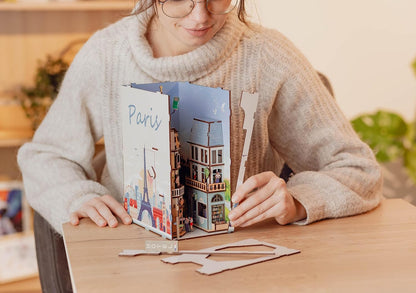 Revell Paris: Tiny Adventures Paris Book Nook - Magical Miniature World for Your Bookshelf, 168 Laser-Cut Wooden Parts with fine details Atmospheric LED Ambient Lighting