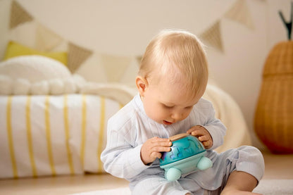Hape Musical Turtle, Musical Toy from Birth, Educational Toy with Sound & Rotating Function, Sensory Toy to Promote Concentration and Motor Skills, Twist & Tune Turtle