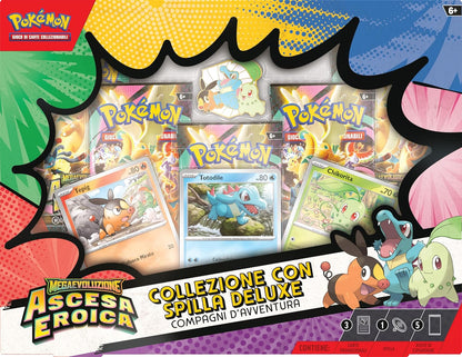 Pokémon: collezione con spilla deluxe Compagni d’avventura dell’espansione Megaevoluzione - Ascesa Eroica del GCC Pokémon (3 carte promozionali olografiche, 1 spilla deluxe e 5 buste di espansione