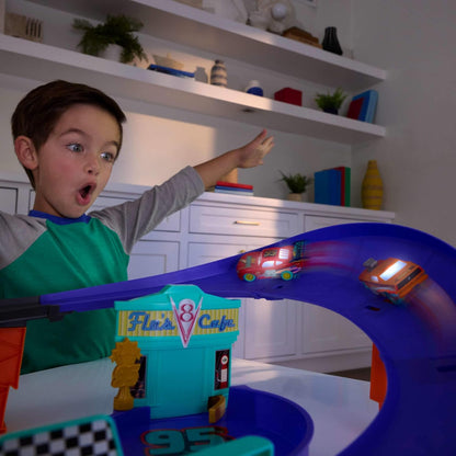 Mattel Disney and Pixar Cars Toy Track Set with Light-Up Lightning McQueen, Race to Celebrate Celebration Raceway Playset with Loop & Wind-Up Kicker, JMT57