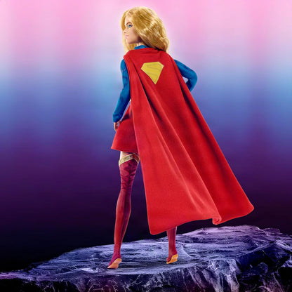 Barbie Signature DC Supergirl Fashion Doll, Blonde with Super Hero Costume & Cape, Collector Doll in Displayable Packaging & Doll Stand, JJY04